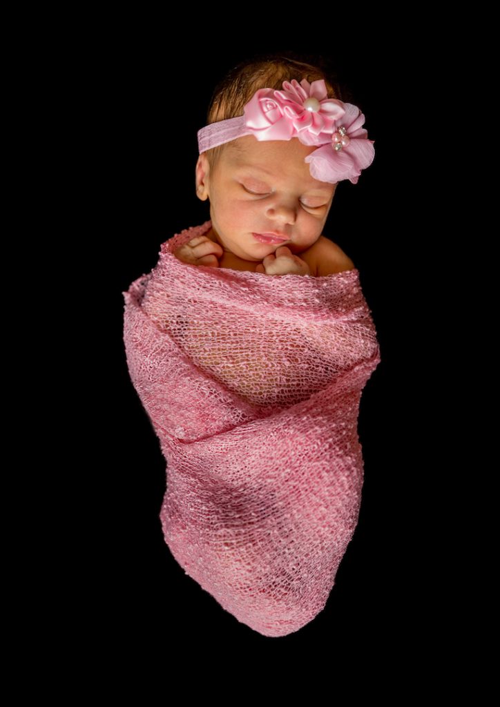 Highly commended image - Bundle of Joy, newborn baby wrapped in pink fabric