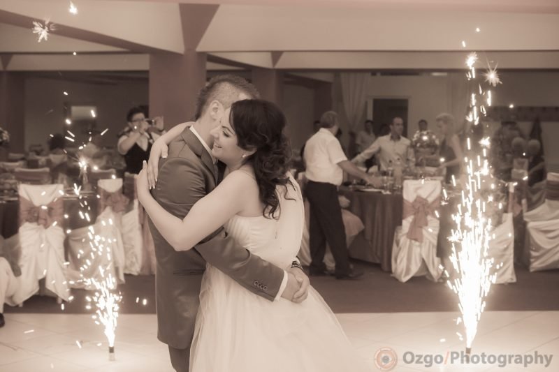 Ozgo Wedding Photography - Bride and groom first dance with fireworks in the background