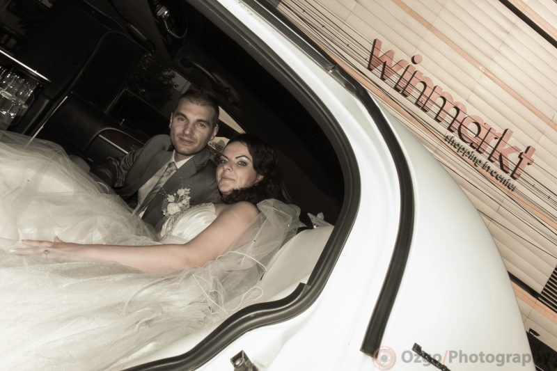 Ozgo Wedding Photography - Bride and groom inside the Limo