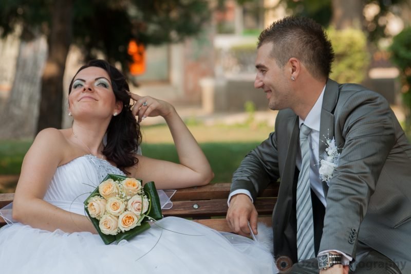 Ozgo Wedding Photography - Bride and Groom on a bench