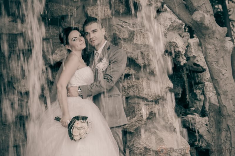 Ozgo Wedding Photography - Bride and groom under a waterfall