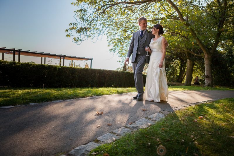 Ozgo Wedding Photography - Groom with the arm around bride shoulder