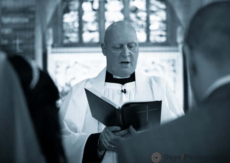 Ozgo Wedding Photography - Priest reading to bride and groom