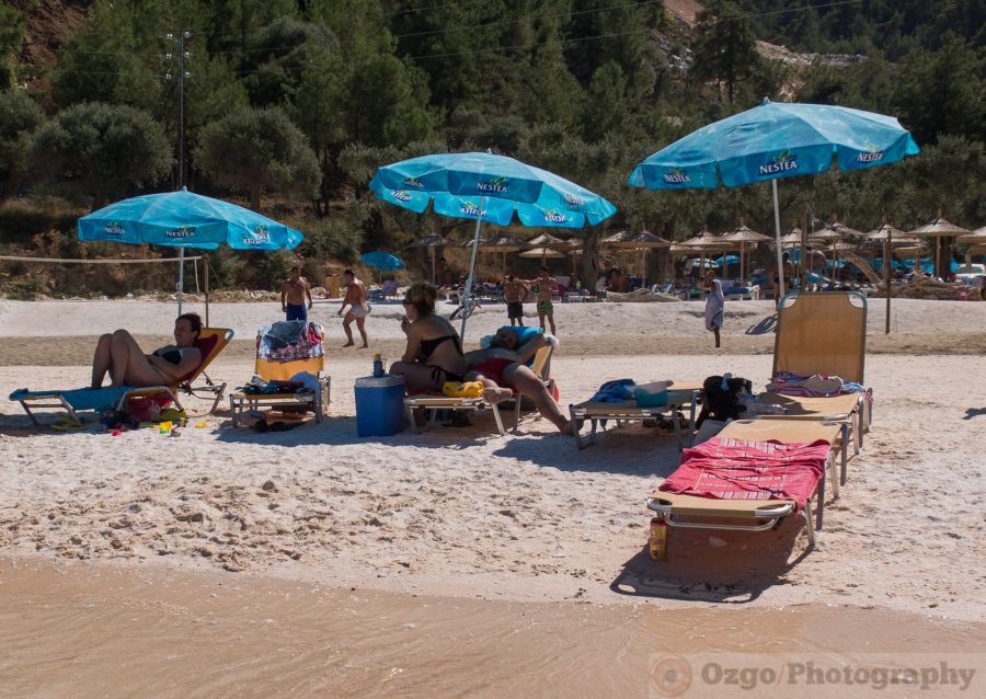 blue umbrellas on the beach, Porto Vathy, Marble Beach, Thassos, Greece