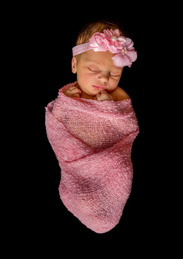 Bundle of Joy, newborn baby wrapped in pink fabric