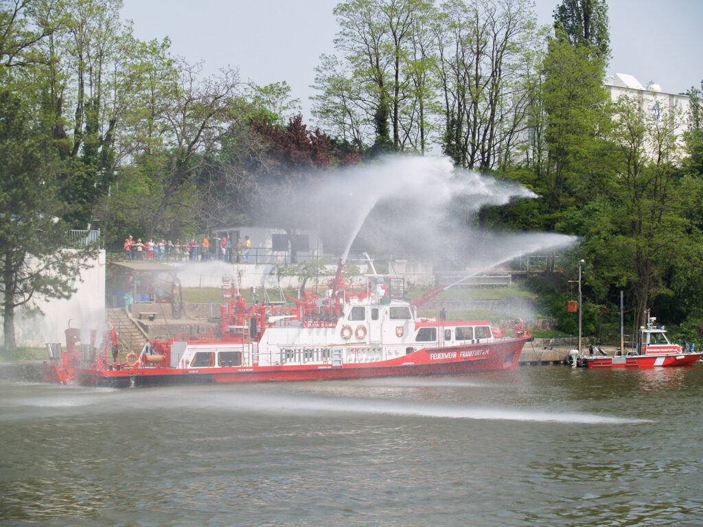Fire tug boat spraying water 